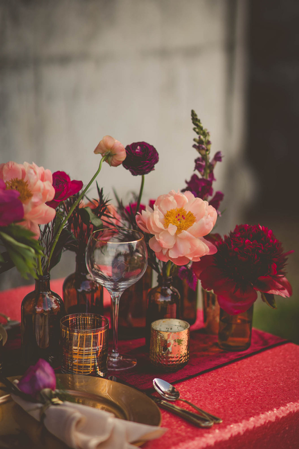 Gold, pink, peach, and red table setting