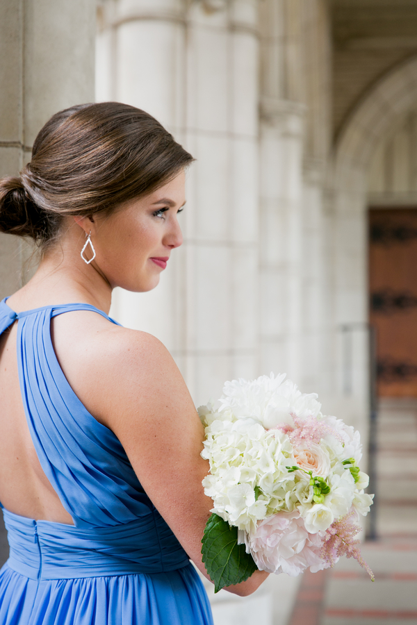 Blue bridesmaid dress and cream wedding bouquet