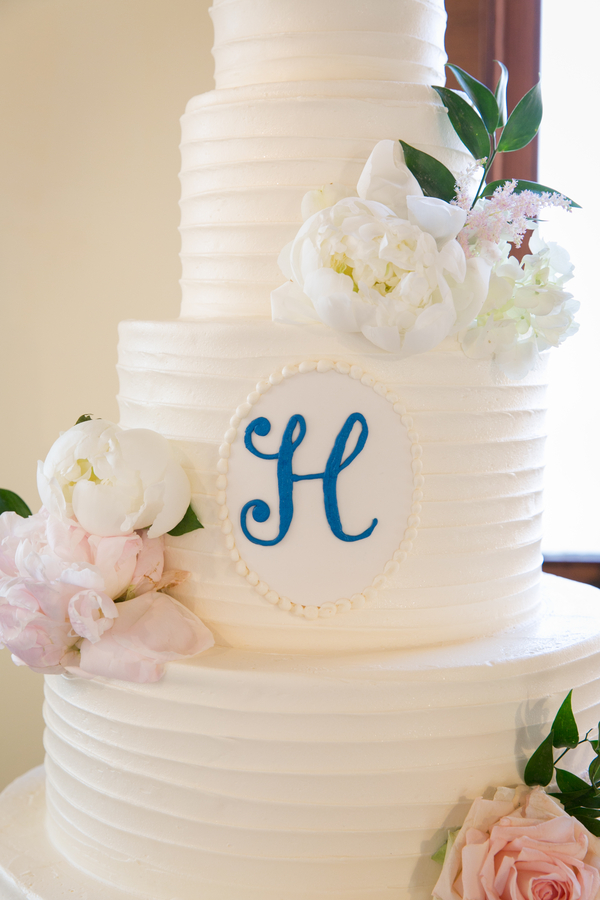 White buttercream wedding cake with monogram