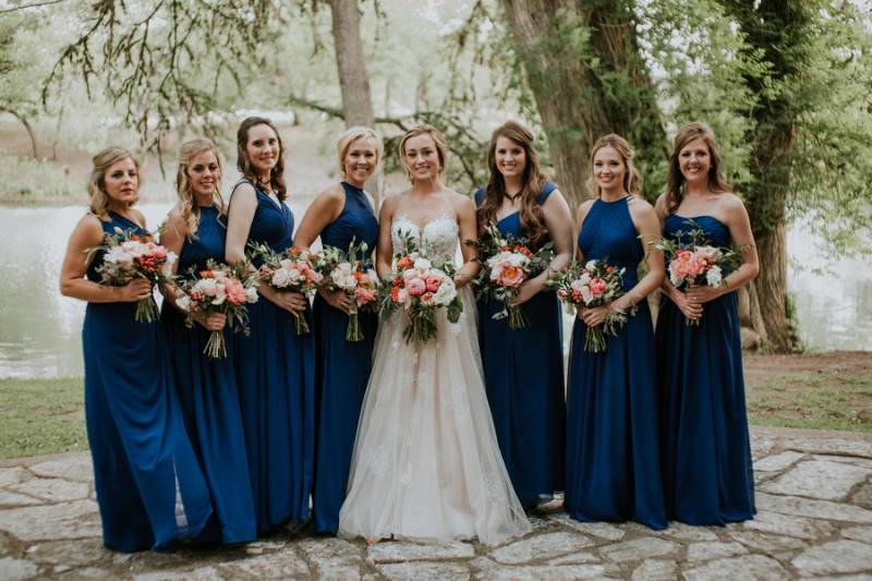 Blue bridesmaid dresses and bouquets