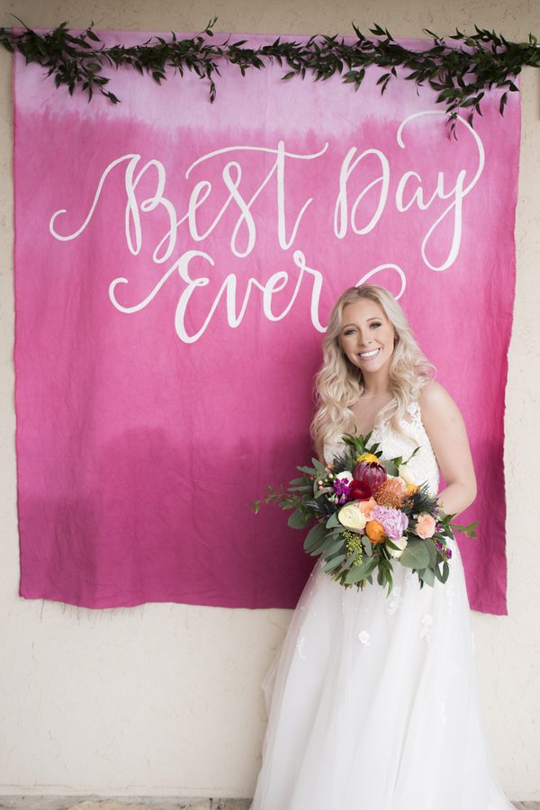 Hot pink wedding sign with white calligraphy