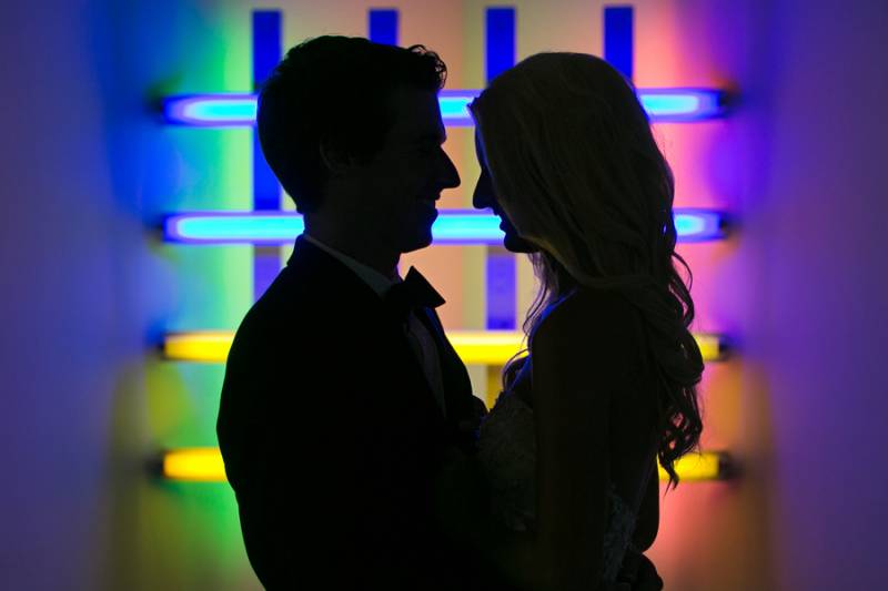 Bride and groom with neon background
