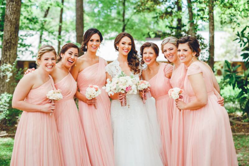 Beautiful bridesmaids in convertible pink dresses