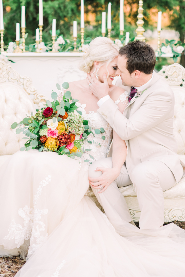Bride and groom with wildflower bouquet