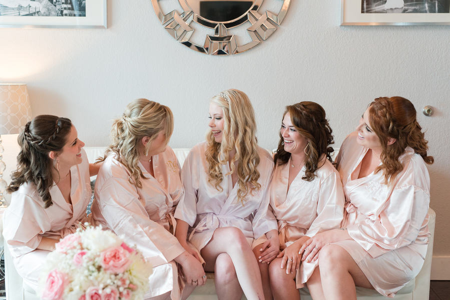 Bridesmaids in pink satin robes