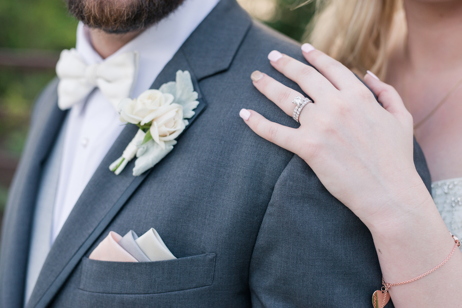 Groom boutonniere and wedding ring