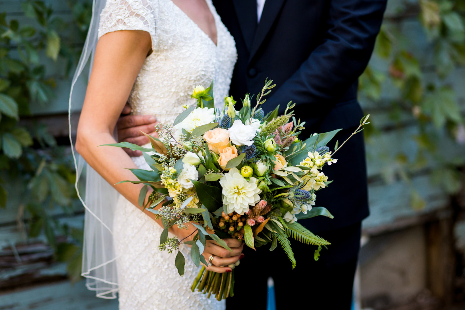 Wildflower green and orange wedding bouquet