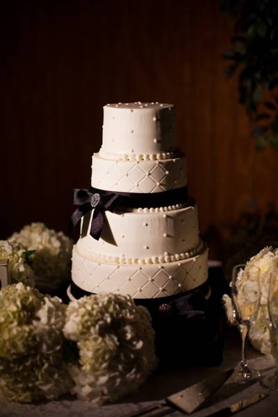 white buttercream wedding cake with black accents