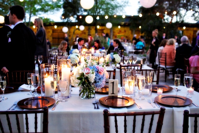 romantic austin wedding - wood chargers, candlelit table setting