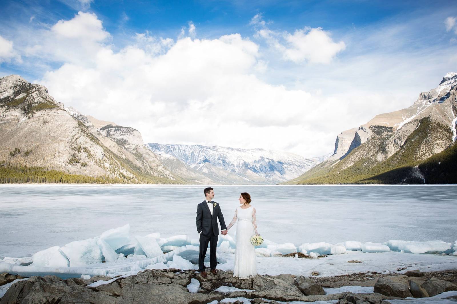 outdoor winter wedding portraits, lake minnewanka, banff wedding photographer, banff winter wedding