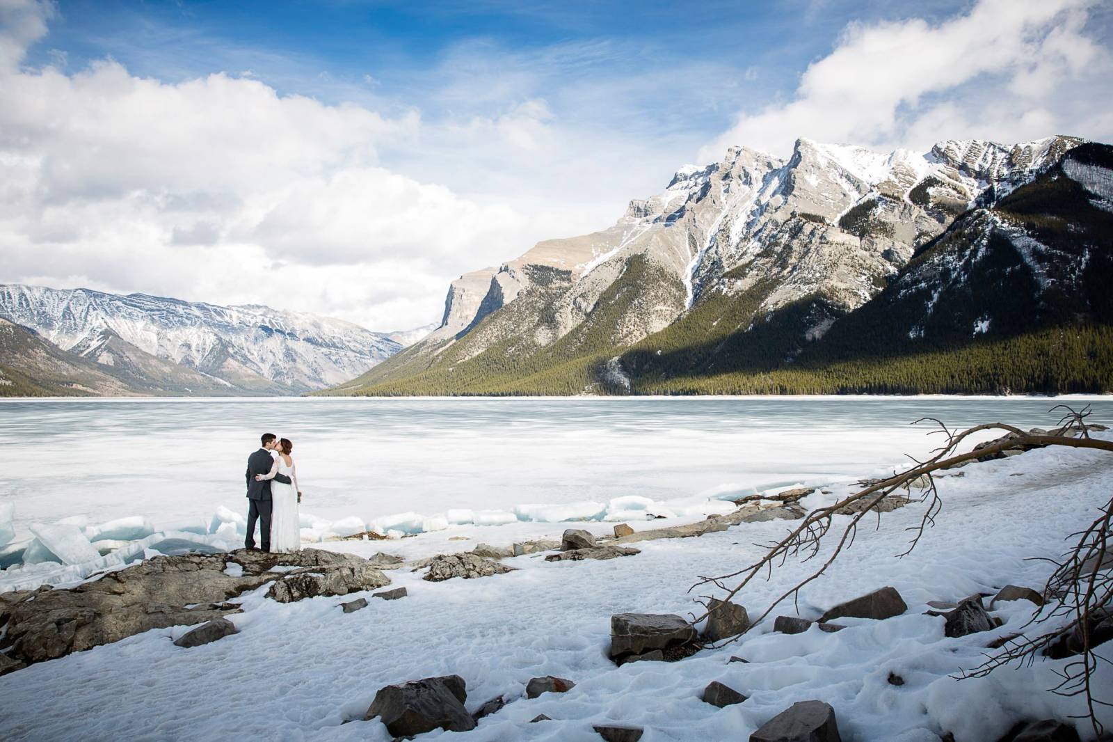 outdoor winter wedding portraits, lake minnewanka, banff wedding photographer, banff winter wedding