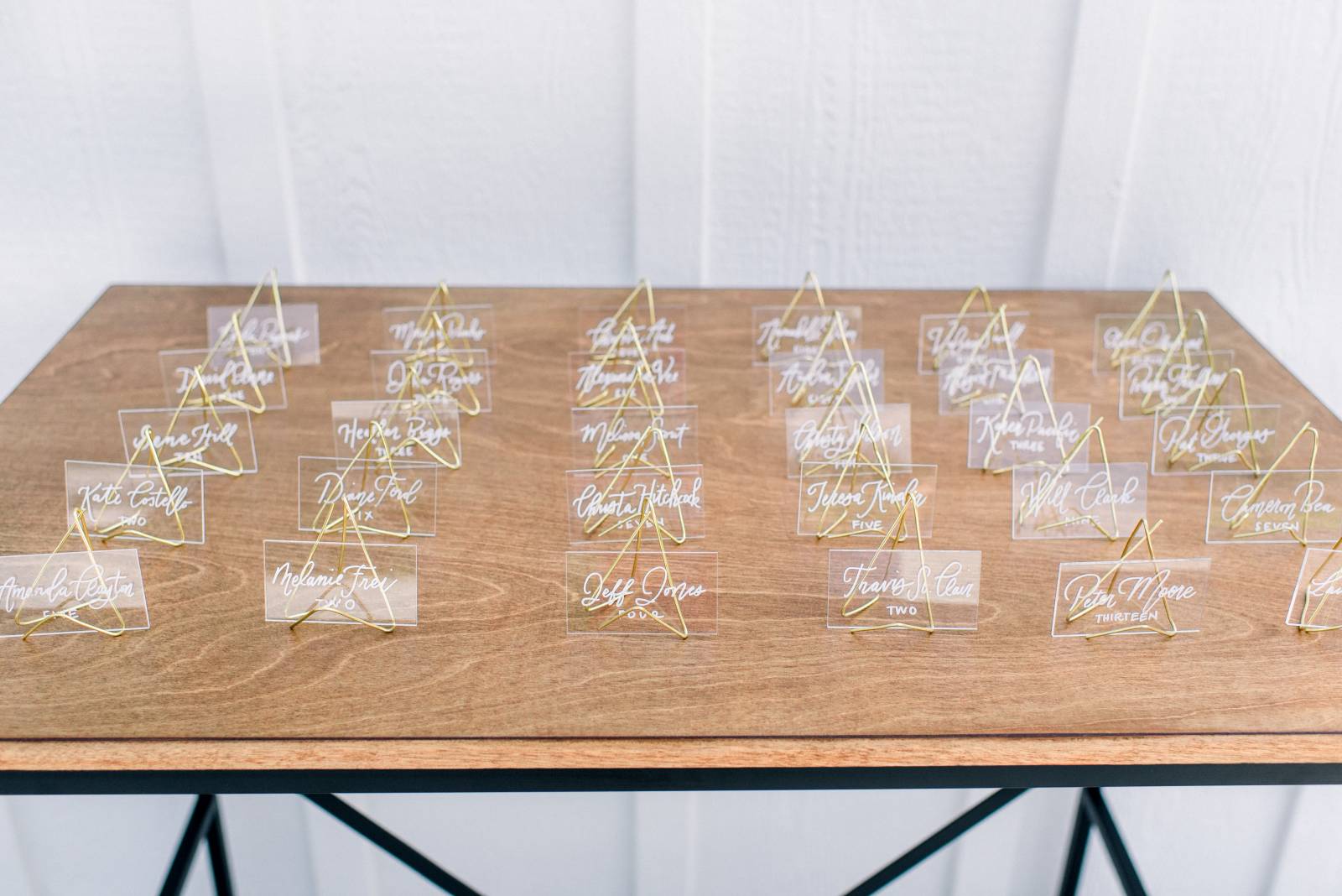 escort cards on gold easels