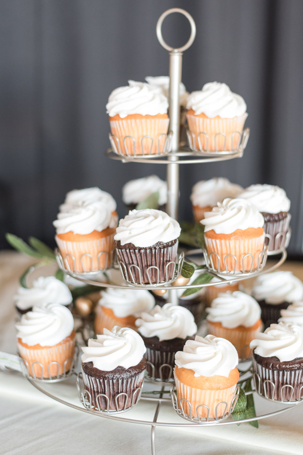 tiered cupcakes on a dessert and wedding cake table